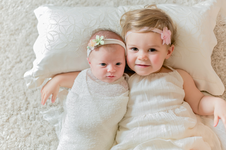 Newborn Lifestyle Session in Northern VA baby sisters together