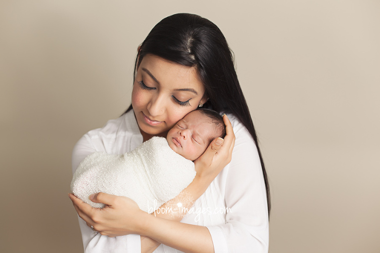 Newborn Photography in Northern Virginia baby with mom snuggly