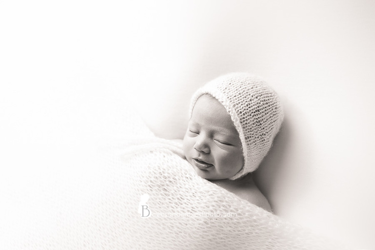 Newborn baby pictures in Northern VA baby wearing hat