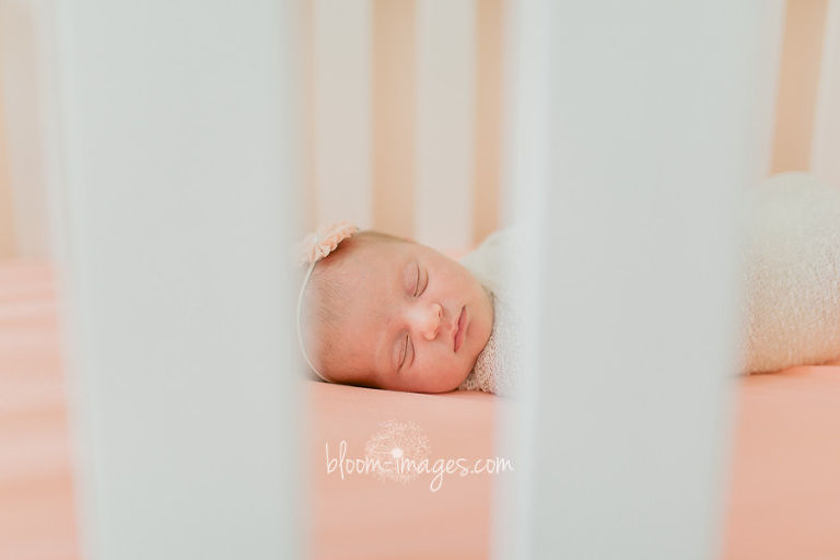 Infant in a crib, at home newborn photo session in Sterling VA